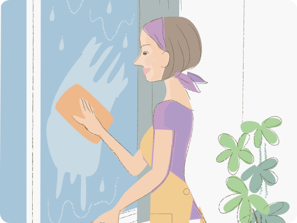 図: 窓を掃除する女性